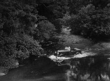 Kitty Brunell road testing a Riley 9 WD tourer, c1930. Artist: Bill Brunell