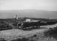 Kitty Brunell road testing a Riley 9 WD tourer, c1930. Artist: Bill Brunell