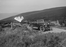 Kitty Brunell road testing a Riley 9 WD tourer, c1930. Artist: Bill Brunell