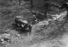 Kitty Brunell road testing a Riley 9 WD tourer, c1930. Artist: Bill Brunell