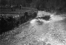Kitty Brunell road testing a Riley 9 WD tourer, c1930. Artist: Bill Brunell