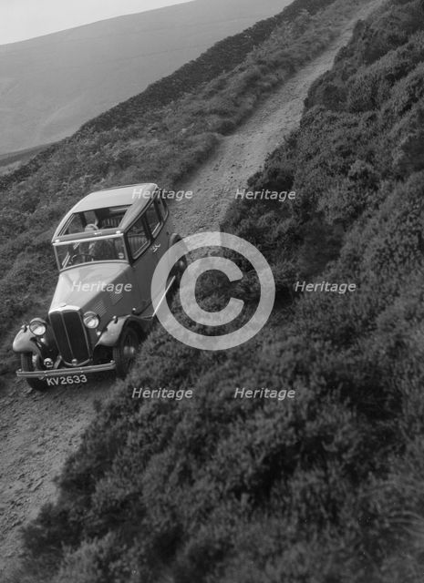 Kitty Brunell road testing a Standard Little Twelve saloon, c1932. Artist: Bill Brunell.