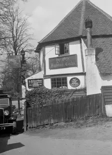 Kitty Brunell's Standard 16 outside Ye Olde Fighting Cocks inn, St Albans, Hertfordshire, 1930s. Artist: Bill Brunell