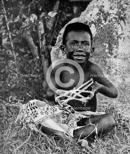 Kiwai child, living at the entrance to the Fly River, New Guinea, 1922. Artist: WN Beaver