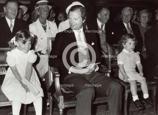 King Carl XVI Gustav of Sweden with Princess Victoria and Prince Carl Philip, 1982.  Creator: Unknown.