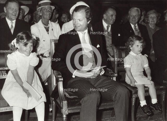 King Carl XVI Gustav of Sweden with Princess Victoria and Prince Carl Philip, 1982. Artist: Unknown
