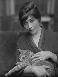 King, Daisy, Miss, with Buzzer the cat, portrait photograph, 1914 June. Creator: Arnold Genthe