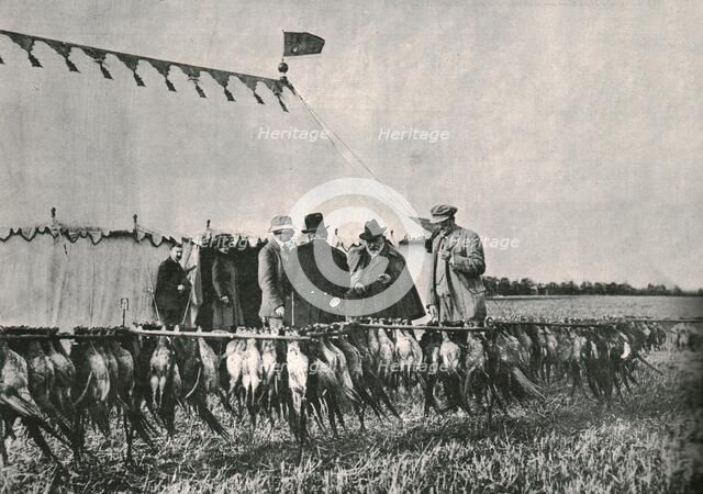 King Edward VII inspecting the bag at Sherborne Estate, 1902, (1910). Creator: Unknown.
