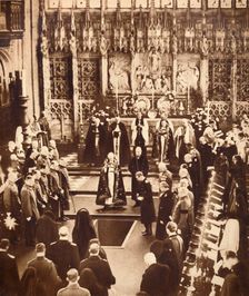 King Edward VIII sprinkles earth on his father's coffin, 1936