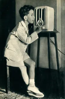 King Faisal of Iraq listening to a broadcast prepared for his birthday by the BBC 1942. Creator: Unknown