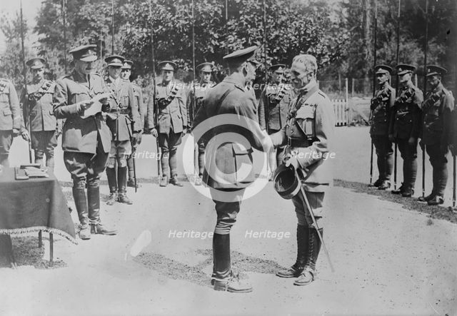 King Geo. decorates French Colonel, 7 Jul 1917. Creator: Bain News Service.