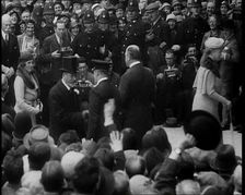 King George V and Other Well Dressed Men and Women Walking Through a Crowd with Photographers...1933 Creator: British Pathe Ltd