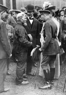 King George V and Queen Mary with a shipwright, Birkenhead, First World War, 1914-1918, (c1920)