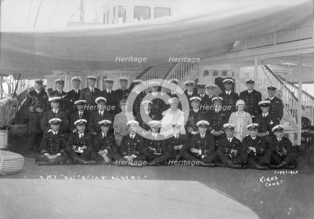 King George V and Queen Mary aboard 'HMY Victoria and Albert', with her crew, c1933. Creator: Kirk & Sons of Cowes.