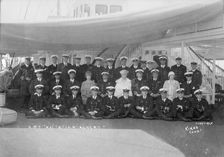 King George V and Queen Mary aboard HMY Victoria and Albert with her crew, c1933. Creator: Kirk & Sons of Cowes