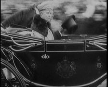 King George V and Queen Mary of Teck Returning to London in an Open Royal Coach, 1929. Creator: British Pathe Ltd