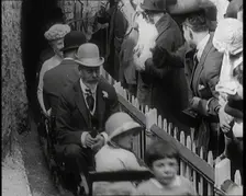 King George V and Queen Mary of the United Kingdom Sit in a Model Train As It Passes..., 1924. Creator: British Pathe Ltd
