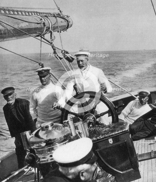 King George V at the helm of his yacht Britannia, c1930s. Artist: Unknown