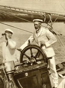 King George V at the wheel of of his yacht, Britannia, during Cowes Regatta week, 1924, (1935). Creator: Unknown