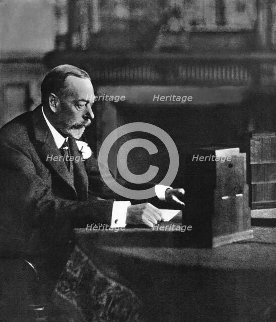 King George V broadcasting to the empire on Christmas Day, Sandringham, 1935. Artist: Unknown