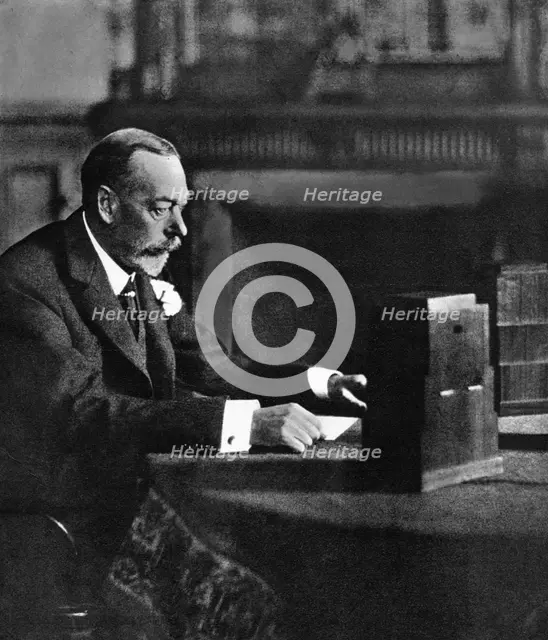 King George V broadcasting to the empire on Christmas Day, Sandringham, 1935. Artist: Unknown