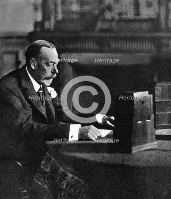 King George V broadcasting to the empire on Christmas Day, Sandringham, 1935. Artist: Unknown