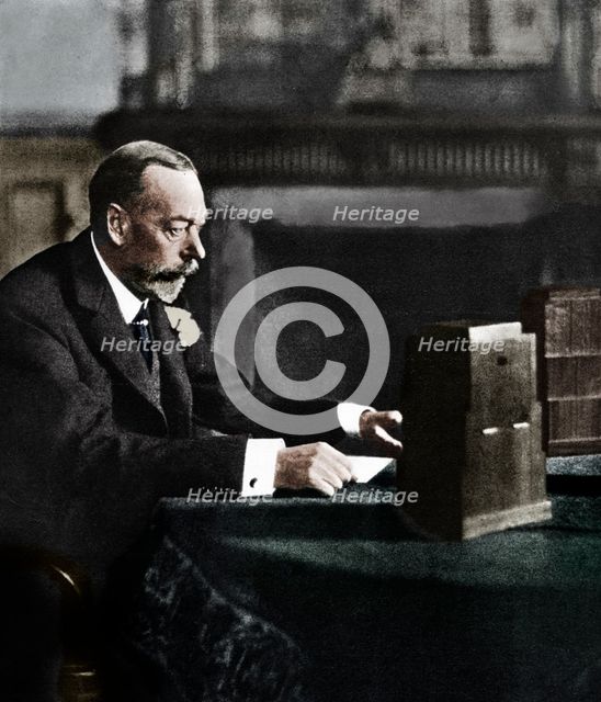 King George V broadcasting to the empire on Christmas Day, Sandringham, 1935. Artist: Unknown.