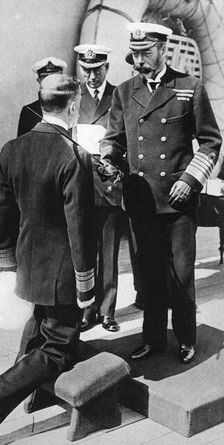 King George V knights Vice-Admiral Pakenham aboard HMS Princess Royal, c1930s