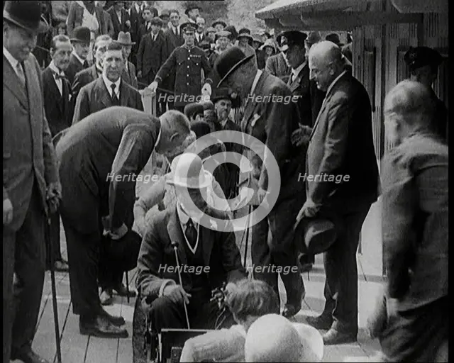 King George V of the United Kingdom Sitting On a Model Train With a Crowd of People Watching, 1924. Creator: British Pathe Ltd.