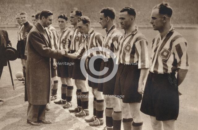 'King George VI and Queen Elizabeth attend the Association Football cup final ', 1937. Artist: Unknown.