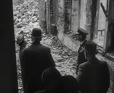 King George VI and Queen Elizabeth Inspecting Bomb Damage, 1942. Creator: British Pathe Ltd