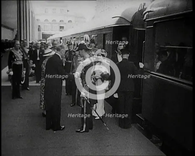 King George VI and Queen Elizabeth of Britain Being Greeted in Paris at Bois de Boulogne..., 1938. Creator: British Pathe Ltd.