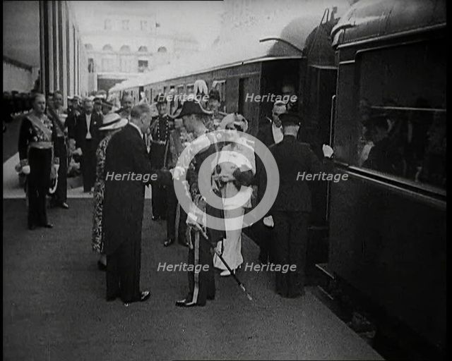 King George VI and Queen Elizabeth of Britain Being Greeted in Paris at Bois de Boulogne..., 1938. Creator: British Pathe Ltd.