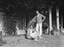 King, Hamilton, Mr. and Mrs., seated on the steps of their home, 1932 or 1933. Creator: Arnold Genthe