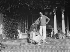 King, Hamilton, Mr. and Mrs., seated on the steps of their home, 1932 or 1933. Creator: Arnold Genthe
