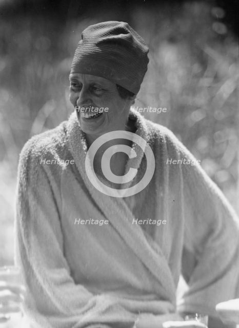 King, Hamilton, Mrs., seated outdoors, 1932 Creator: Arnold Genthe.