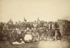 Kirghiz (ie Kazakh) tribesmen with a local Russian Governor and his wife, between 1885 and 1886. Creator: Unknown