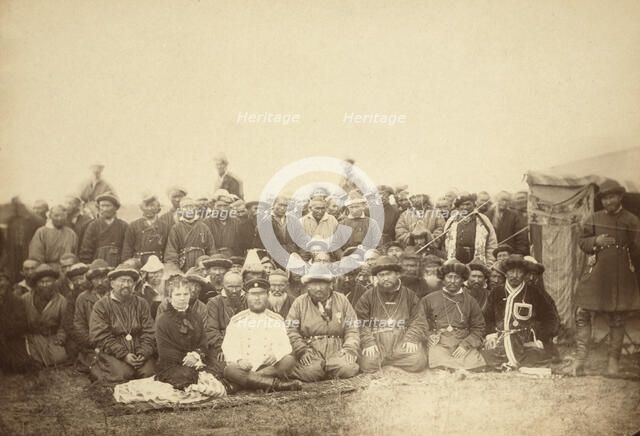 Kirghiz (ie Kazakh) tribesmen with a local Russian Governor and his wife, between 1885 and 1886. Creator: Unknown.