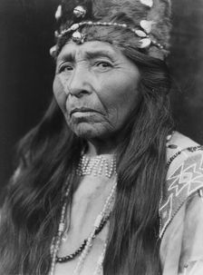 Klamath woman, head-and-shoulders portrait, facing left, c1923. Creator: Edward Sheriff Curtis