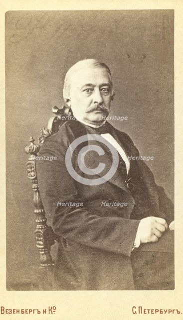 Kraevskii, Andrei Aleksandrovich, half-length portrait, seated, facing..., between 1880 and 1886. Creator: Unknown.