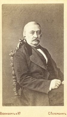 Kraevskii, Andrei Aleksandrovich, half-length portrait, seated, facing..., between 1880 and 1886. Creator: Unknown