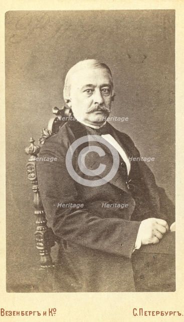 Kraevskii, Andrei Aleksandrovich, half-length portrait, seated, facing..., between 1880 and 1886. Creator: Unknown.