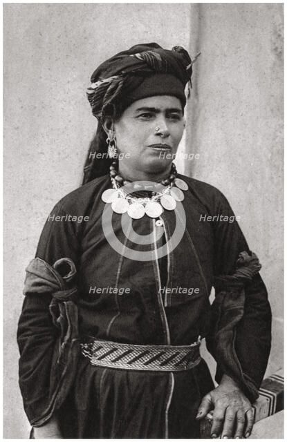 Kurdish lady in her best costume, Iraq, 1925. Artist: A Kerim