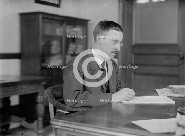H.L. Stimson at desk writing, 1910. Creator: Bain News Service.