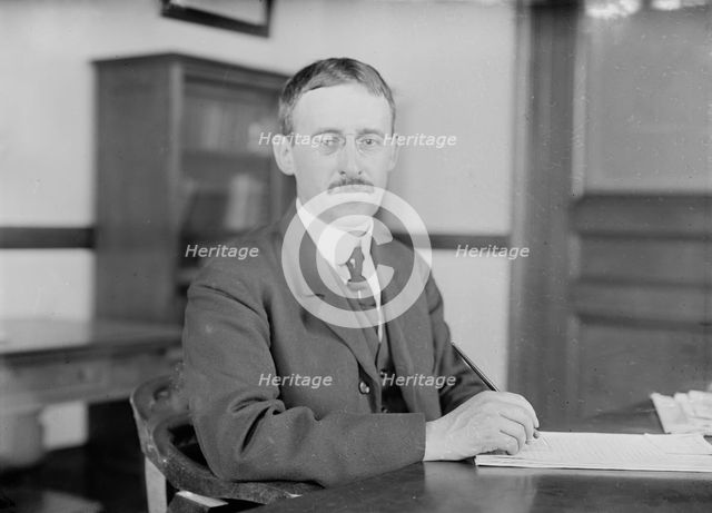 H.L. Stimson at desk writing, 1910. Creator: Bain News Service.