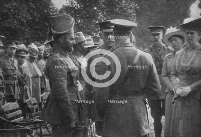 'H.M. King George V Talking To Sir Walter Lawrence and Mir Dast, V.C., 25th August 1915', (1939). Artist: Unknown.