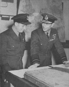 H.M. The King learns details of the R.A.F. raid on the Ruhr dams on May 17, 1943 1943-44
