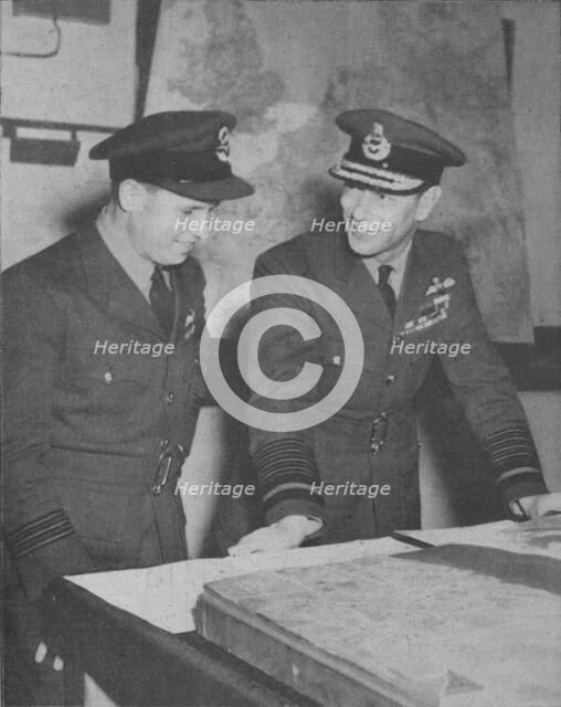 'H.M. The King learns details of the R.A.F. raid on the Ruhr dams on May 17, 1943', 1943-44. Artist: Unknown.