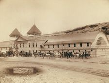 Hot Springs, SD Exterior view of largest plunge bath house in US on FE and MV R'y, 1891. Creator: John C. H. Grabill