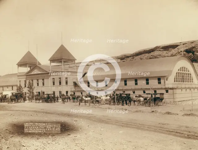 Hot Springs, SD Exterior view of largest plunge bath house in US on FE and MV R'y, 1891. Creator: John C. H. Grabill.